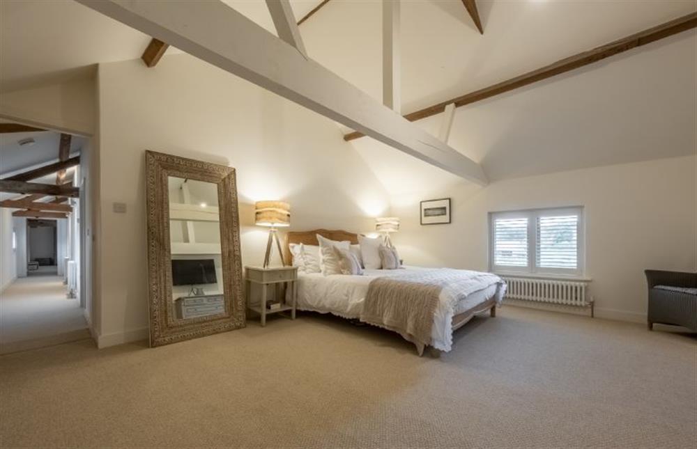 Master bedroom with super-king bed at The Hayloft, Felbrigg near Norwich