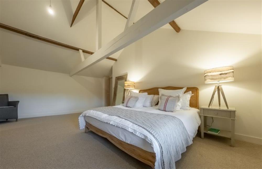 Master bedroom with vaulted ceiling at The Hayloft, Felbrigg near Norwich