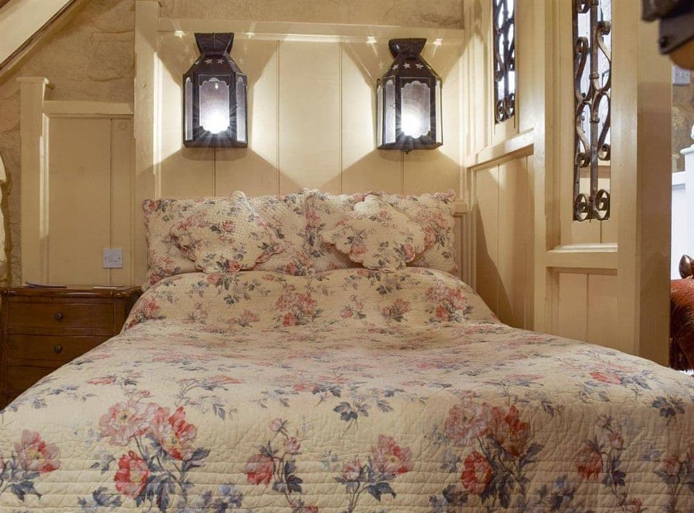 Partitioned sleeping area with comfortable double bed at The Hayloft in Glaisdale, Nr Whitby, North Yorkshire., Great Britain