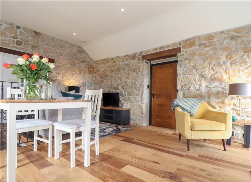 Relax in the living area at The Hayloft, Helston