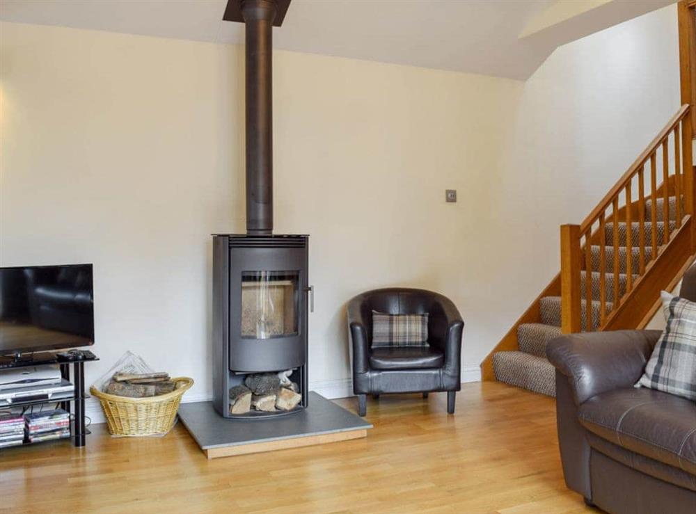 Cosy wood burner in the living area at The Hayloft in Kidderminster, Worcestershire