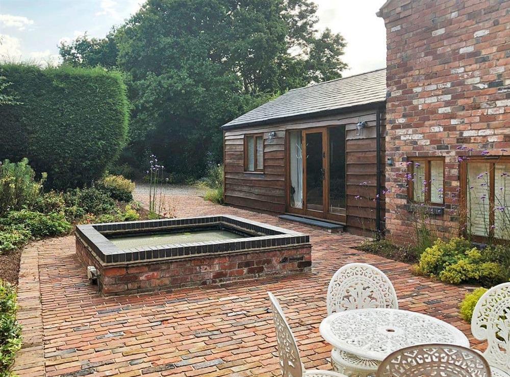 Lovely courtyard with sitting-out area at The Hayloft in Kidderminster, Worcestershire