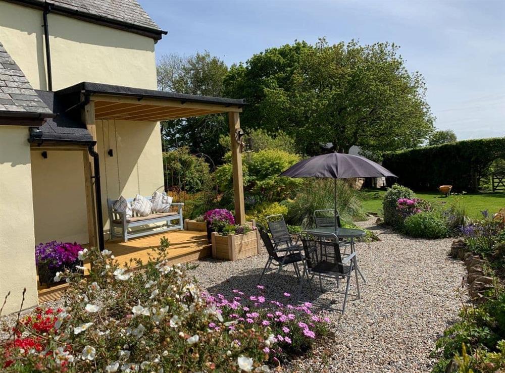 Glorious garden seating area, with long distance countryside views (photo 2) at The Headmasters Cottage in South Hill, near Callington, Cornwall