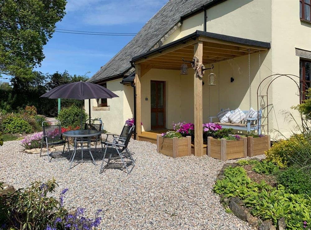 Glorious garden seating area, with long distance countryside views at The Headmasters Cottage in South Hill, near Callington, Cornwall