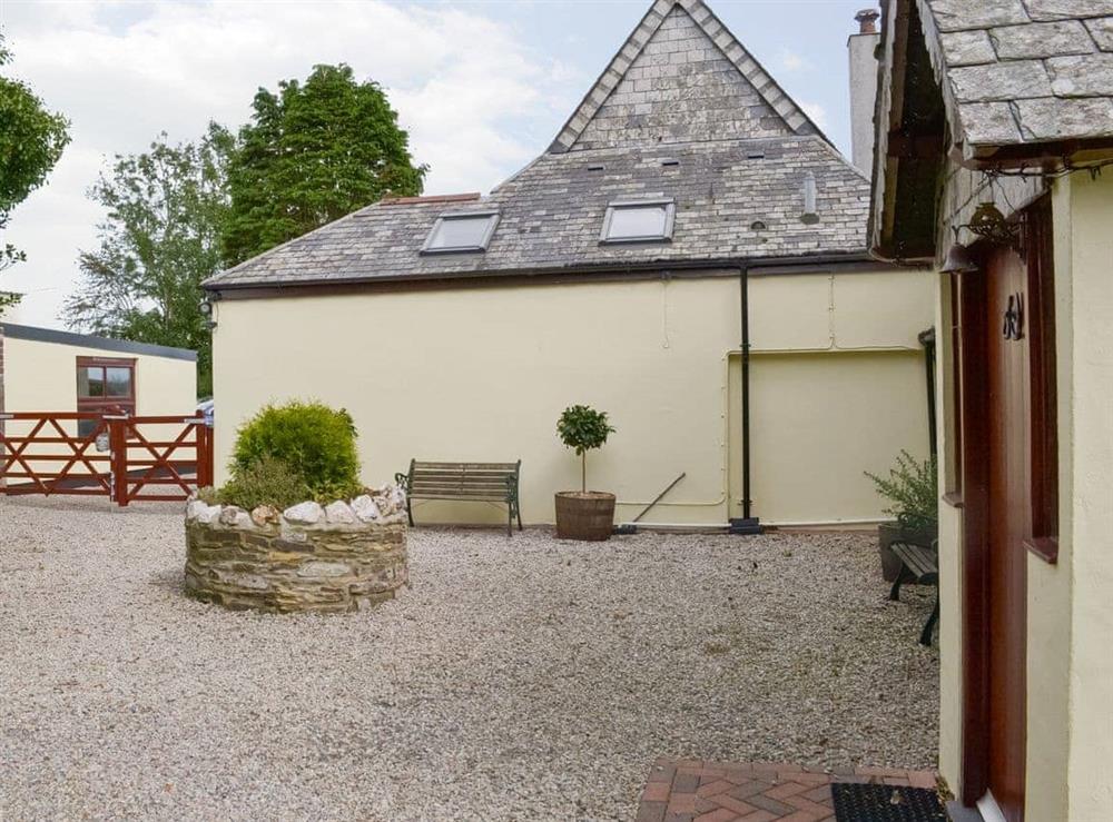 Pretty cottage courtyard, with further seating at The Headmasters Cottage in South Hill, near Callington, Cornwall