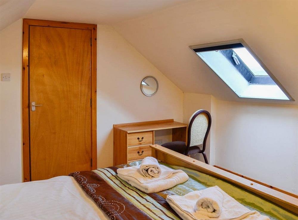 Double bedroom with sloping ceilings at The Hen Hoose in Steading, near Newton Stewart, Wigtownshire