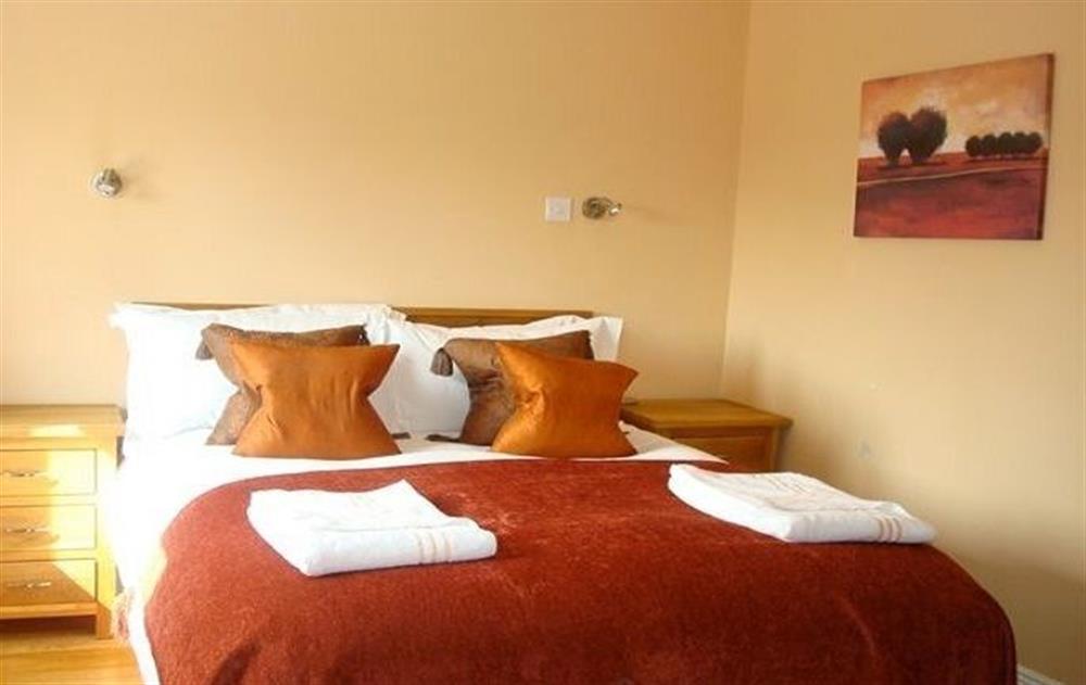 First floor: Double bedroom with zip and link beds  at The Hen House, Navan