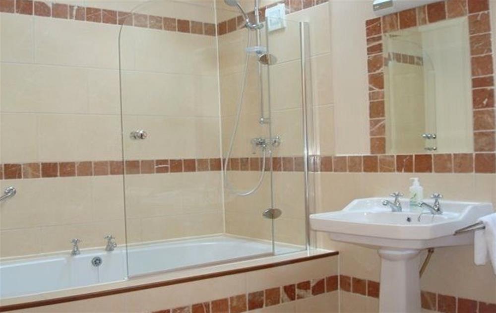 First floor:  En-suite bathroom with a jacuzzi bath and shower over at The Hen House, Navan