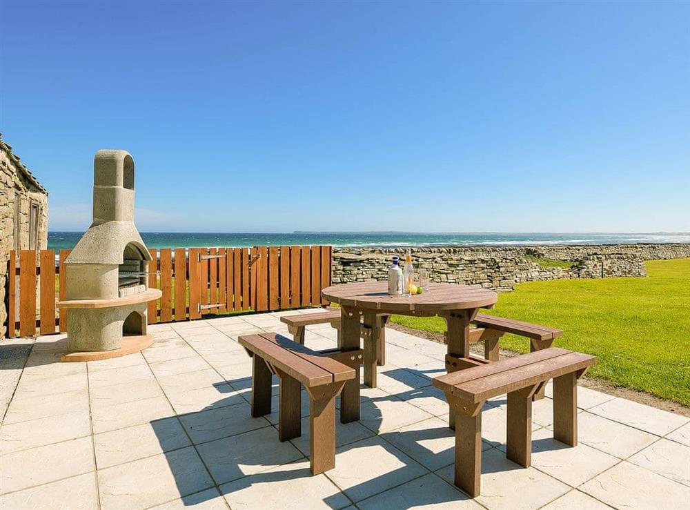 Outdoor area with sea views at The Herons in South Keiss, near Wick, Caithness
