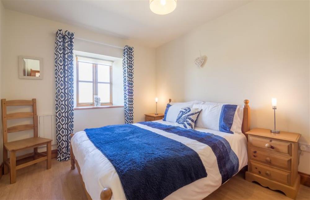 Ground floor: Bedroom with king-size bed at The Heydon, Roughton near Cromer