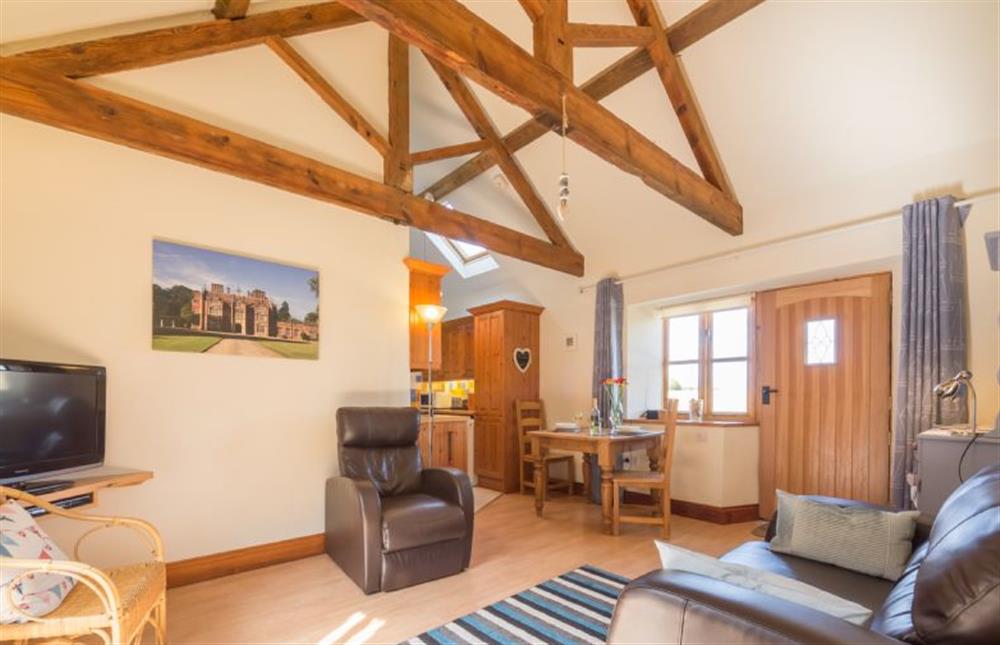 Ground floor: Sitting room area with comfy seating at The Heydon, Roughton near Cromer