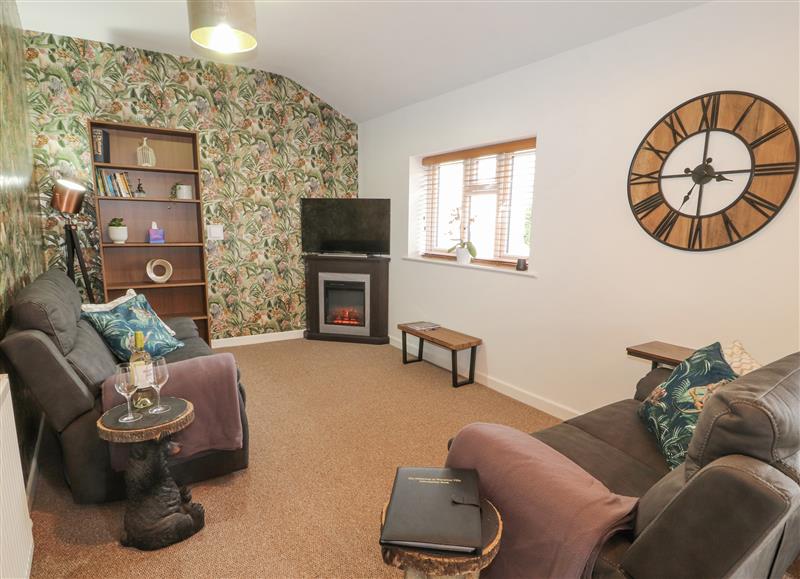 Relax in the living area at The Hideaway @ Waverton Villa, Wigton
