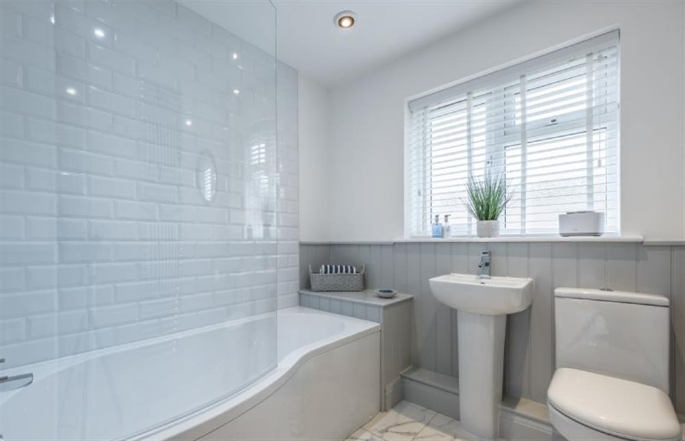 Ground floor: The family bathroom has a bath with shower over at The Hideaway, Docking near Kings Lynn