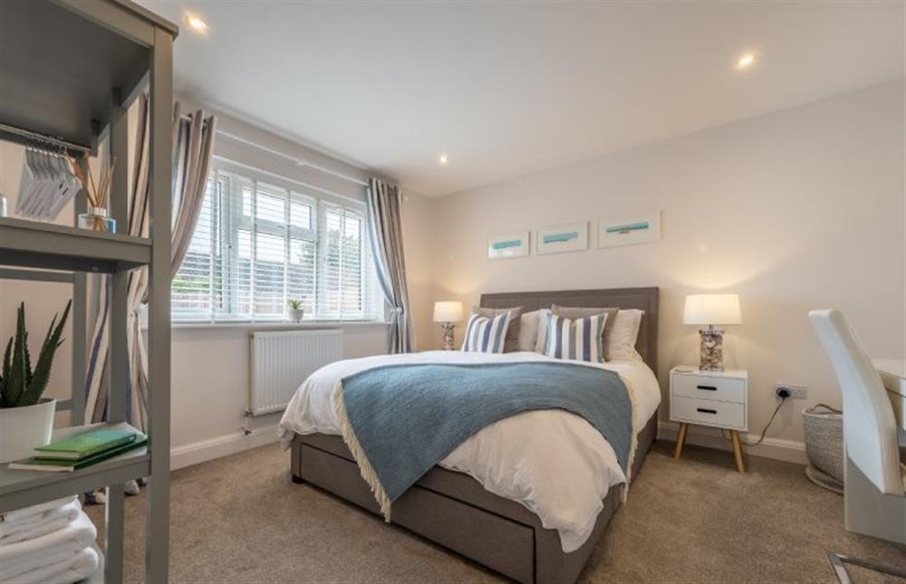 Ground floor: The stylish master bedroom has a king-size bed at The Hideaway, Docking near Kings Lynn