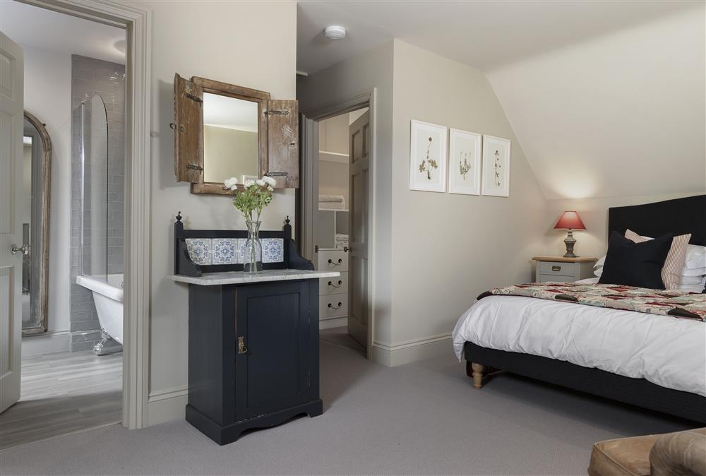 Bedroom leading to en-suite and dressing room at The Hideaway,  Lower Oddington