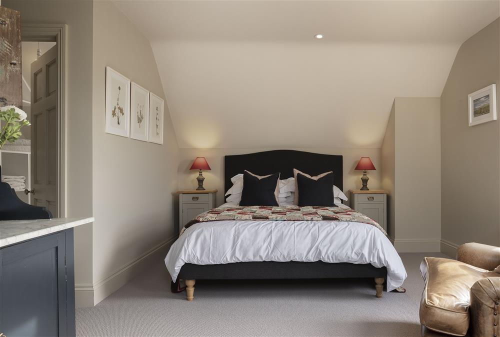 Bedroom with a king-size bed at The Hideaway,  Lower Oddington