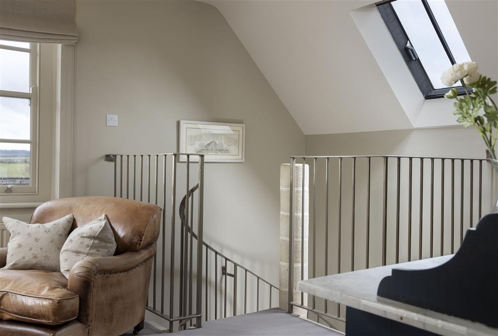 Stone spiral staircase leading up to the beautiful bedroom at The Hideaway,  Lower Oddington