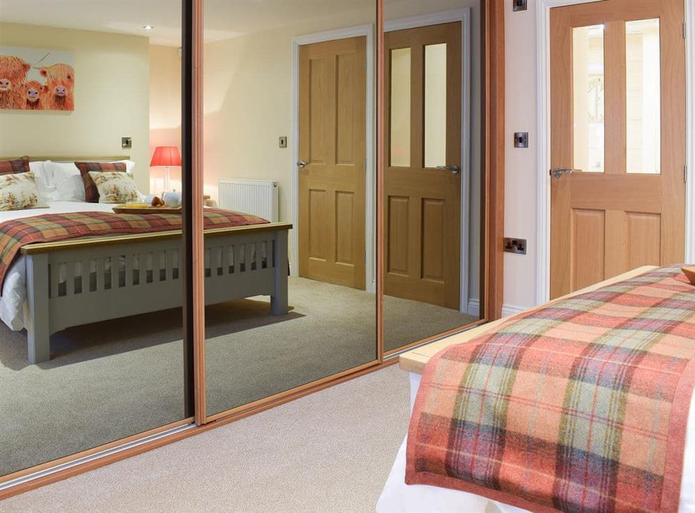 Double bedroom with ample storage at The Hideaway in Sleights, near Whitby, North Yorkshire