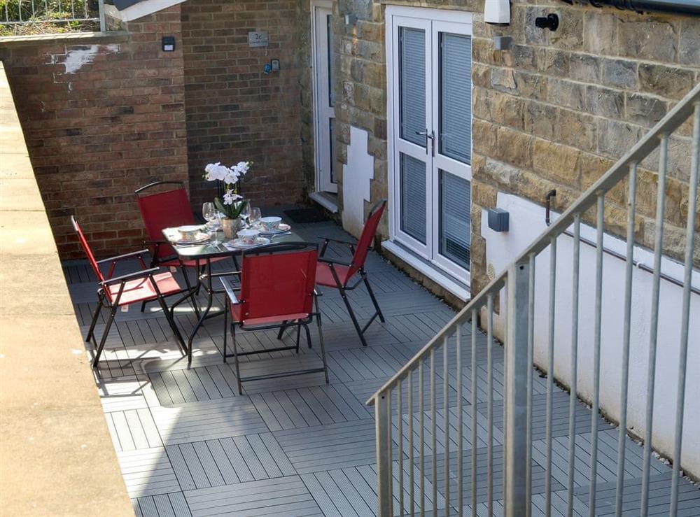Enclosed sitting-out area with garden furniture (photo 2) at The Hideaway in Sleights, near Whitby, North Yorkshire