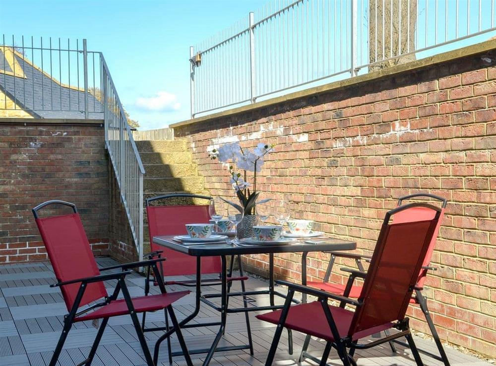 Enclosed sitting-out area with garden furniture (photo 3) at The Hideaway in Sleights, near Whitby, North Yorkshire