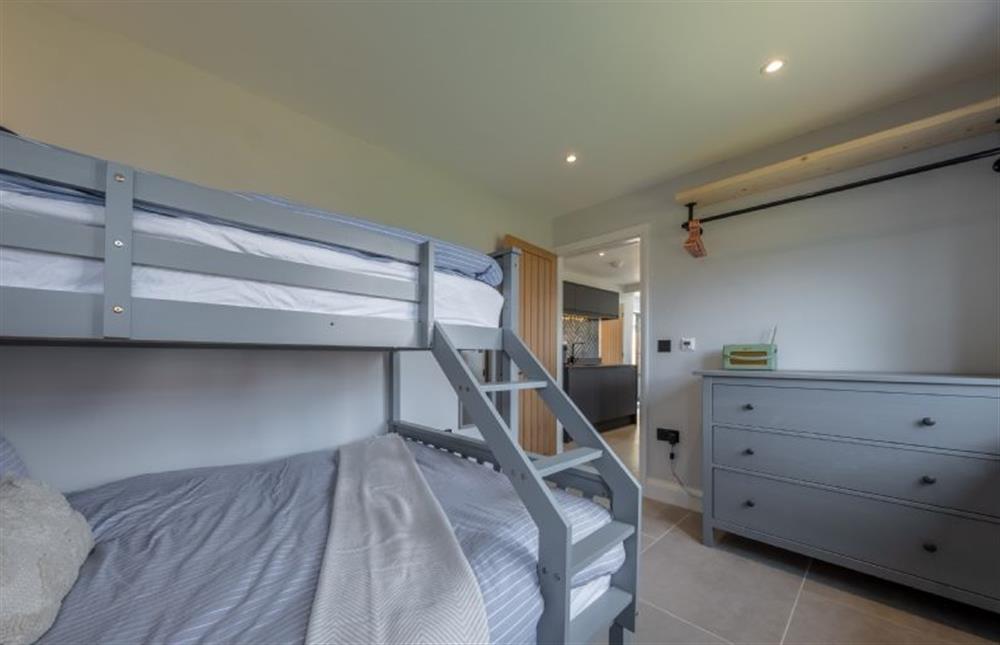 Ground floor: Bedroom two with double and single bunk bed at The Hideaway, Snettisham near Kings Lynn