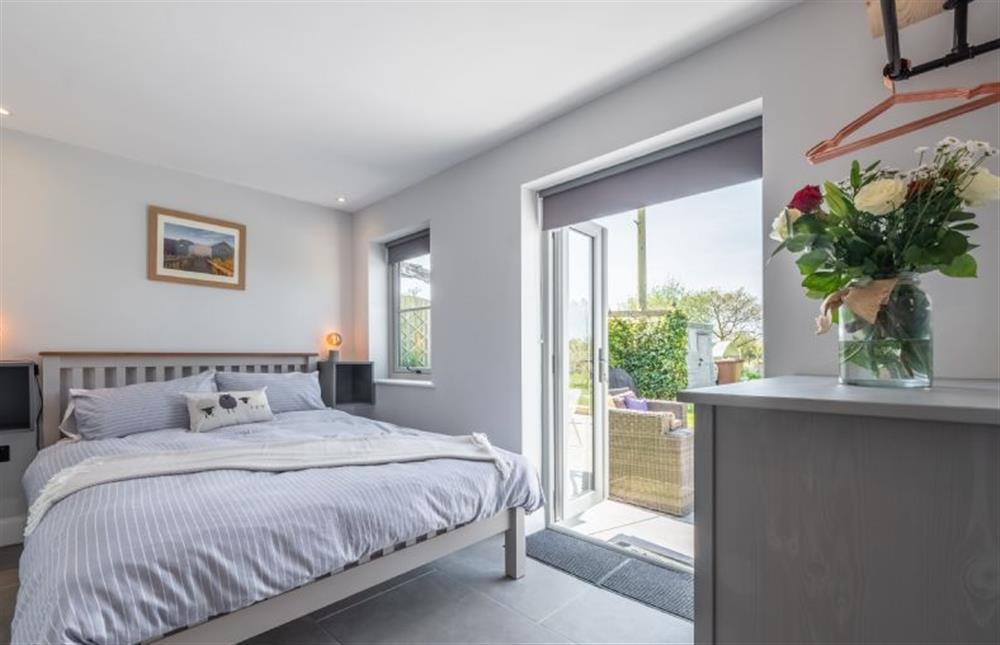 Ground floor: Master bedroom with king-size bed at The Hideaway, Snettisham near Kings Lynn