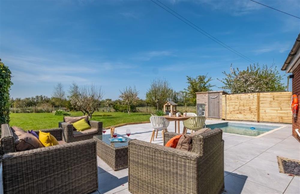 Spacious patio area with lounge seating at The Hideaway, Snettisham near Kings Lynn