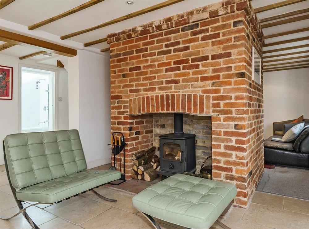 Stylishly furnished living room with wood burner at The High Street in Orford, near Aldeburgh, Suffolk, England