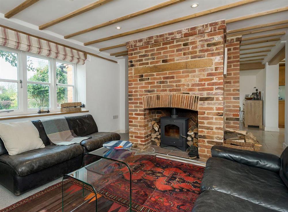 Warm and toasty living room with wood burner at The High Street in Orford, near Aldeburgh, Suffolk, England