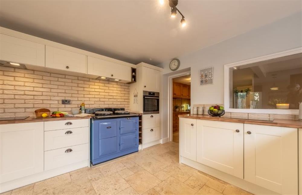 Ground floor: Kitchen with Aga, electric oven and induction hob at The Homestead and Black Cat Barn, Southrepps near Norwich