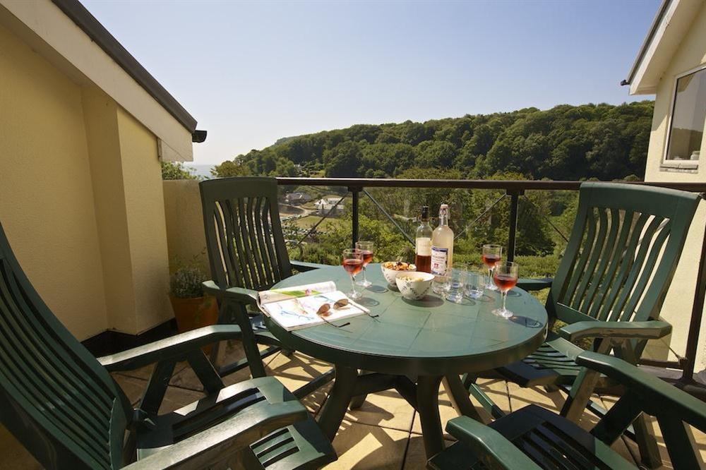 Balcony with outdoor furniture to take in the views over North Sands at The Hoot in Sandhills Road, Salcombe