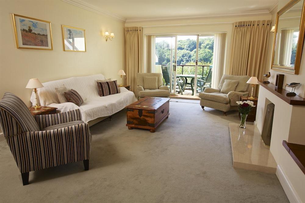 Lounge with patio doors leading to balcony at The Hoot in Sandhills Road, Salcombe