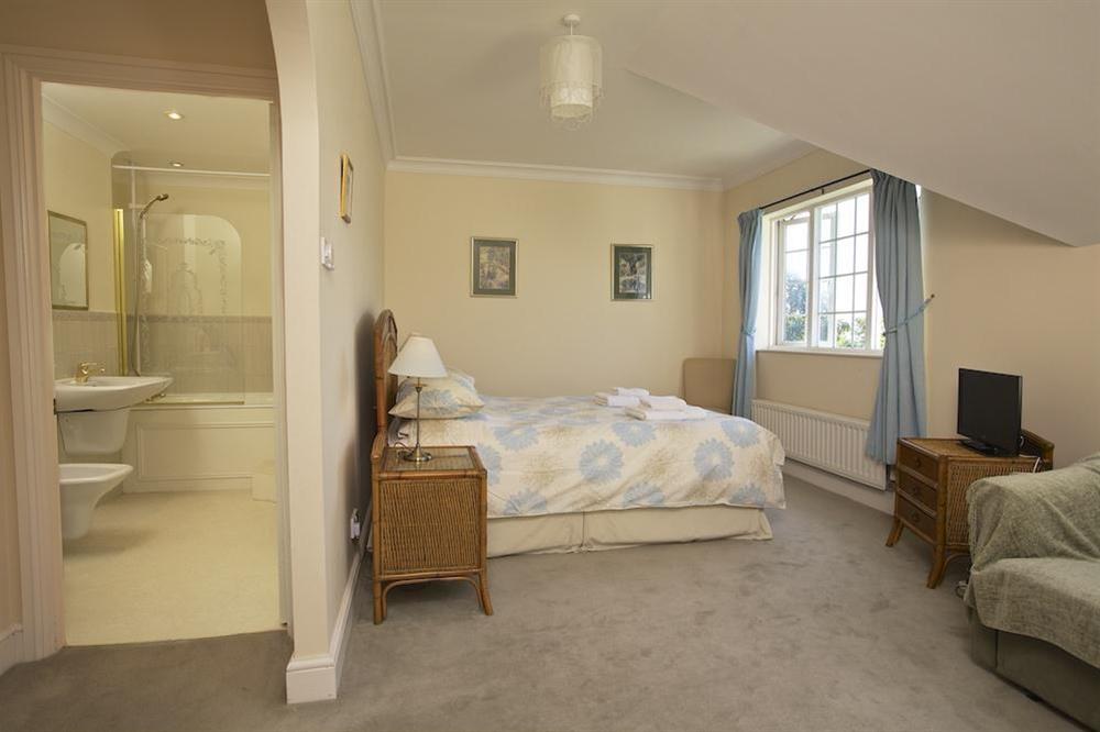 Master bedroom with en suite bathroom at The Hoot in Sandhills Road, Salcombe