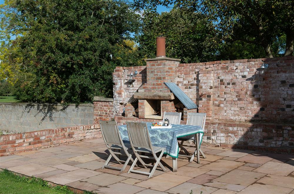 Enjoy the morning sun and views from the garden terrace  at The Hop Kiln, Bosbury