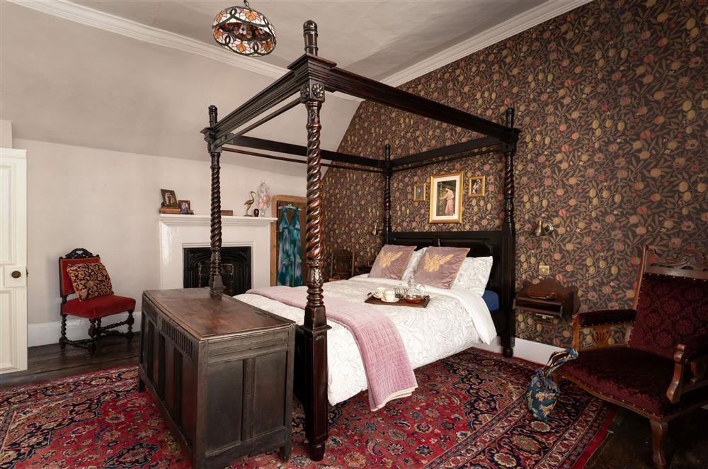 Bedroom four with its ornamental fireplace at The House of Black and White, Great Torrington