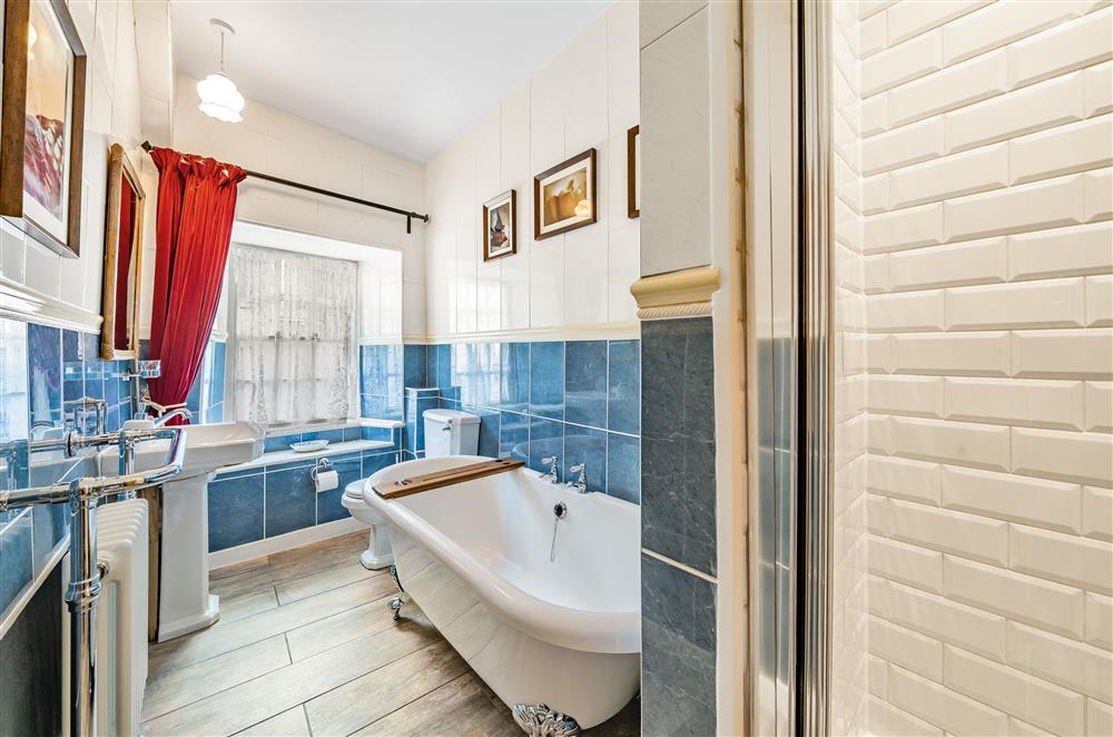 The first floor family bathroom with roll top bath  at The House of Black and White, Great Torrington