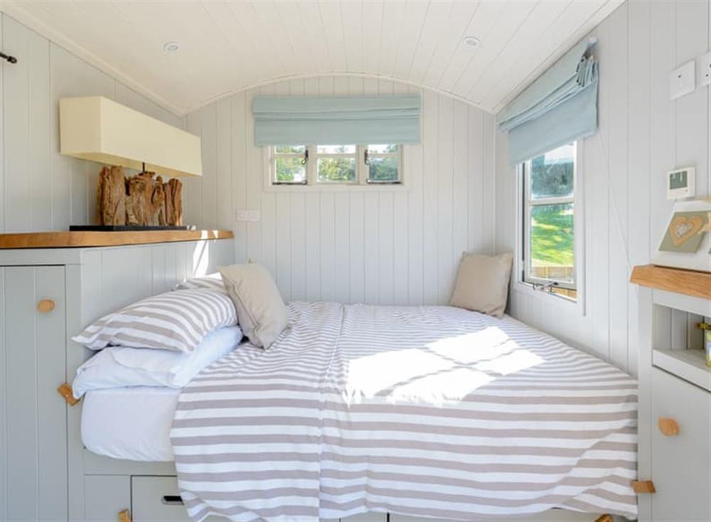 Relaxing double bed at The Hut at Hole Farm in Alderbury,  Salisbury, England