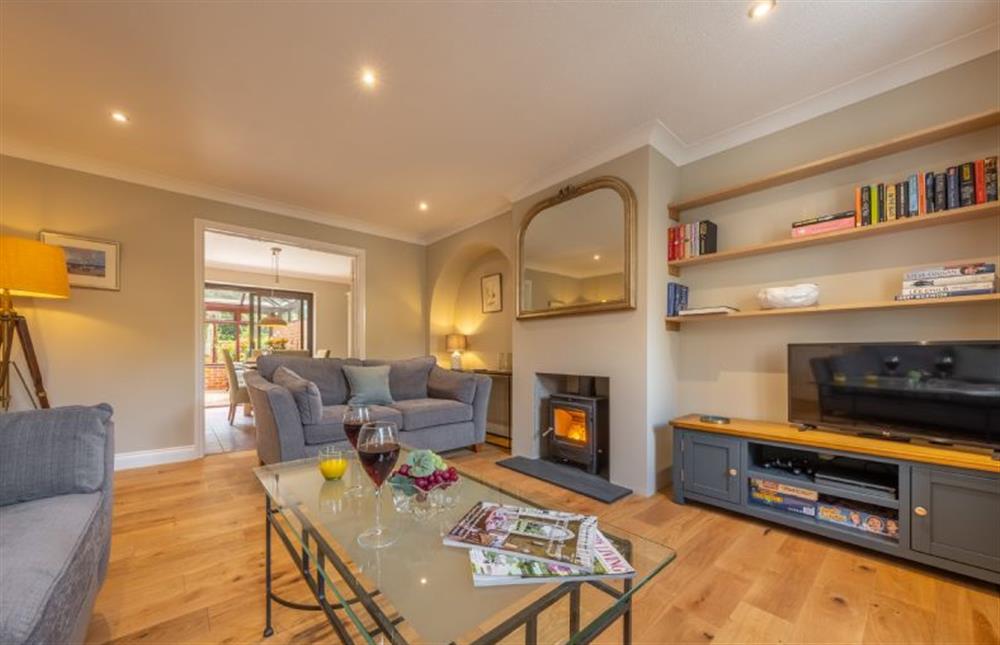 Ground floor: Spacious sitting room with wood burning stove at The Innings, Burnham Deepdale near Kings Lynn