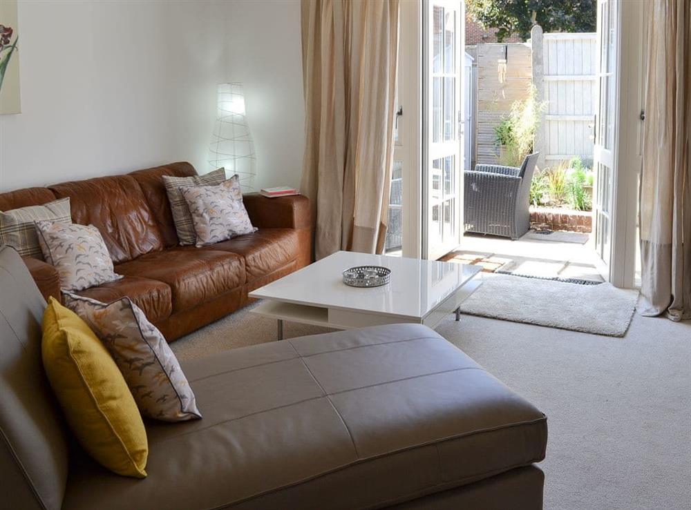 Lounge area with French doors leading to garden area at The Jolly in Whitstable, Kent
