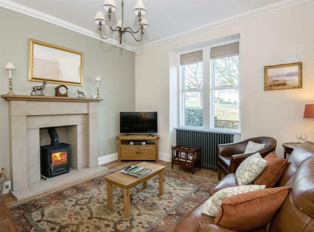 Cosy living room with wood burner at The Laburnums in Askham, near Penrith, Cumbria
