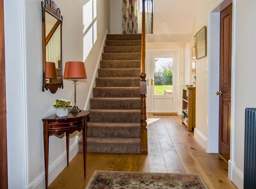 Large welcoming entrance hall with original 19th century staircase at The Laburnums in Askham, near Penrith, Cumbria