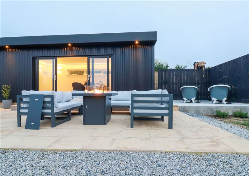 Enjoy a cup of tea on the patio at The Lake Boat exclusive retreat, Black Cross near St Columb Major