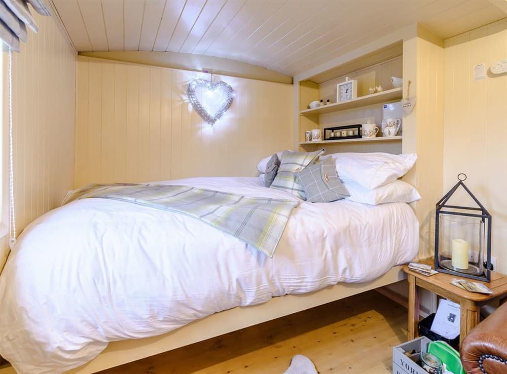 Double bed within the sleeping area at The Lambing Shed in South Hiendley, near Hemsworth, West Yorkshire