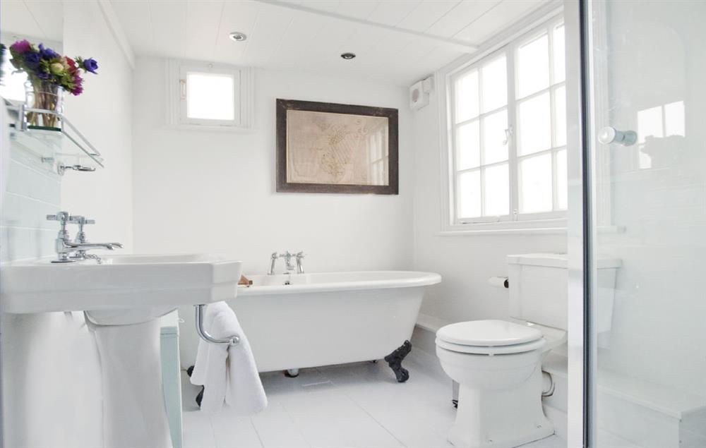 Bathroom with walk in high pressure shower and claw foot roll-top bath for two at The Langley Tarne, Mousehole