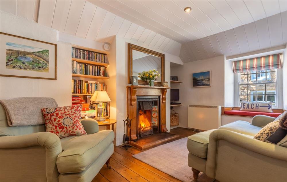 Open plan sitting room with wood burning stove at The Langley Tarne, Mousehole