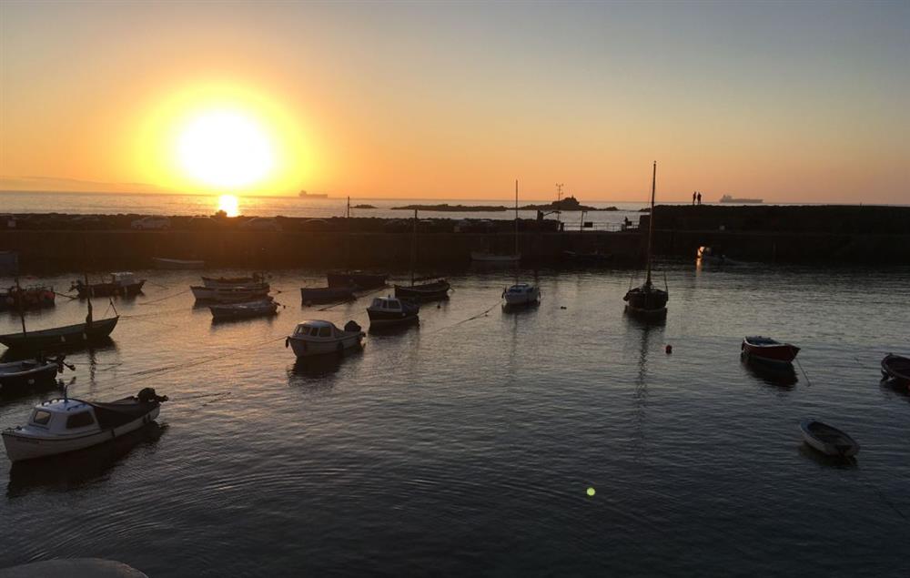 Sunset in Mousehole Harbour at The Langley Tarne, Mousehole