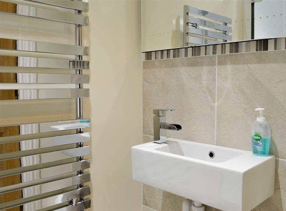 Bathroom with heated towel rail at The Larches in Keswick, Cumbria
