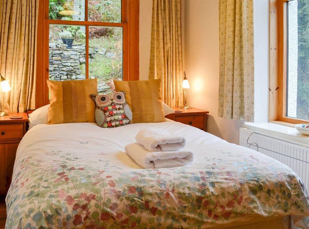 Romantic and inviting double bedroom with double aspect views at The Larches in Keswick, Cumbria