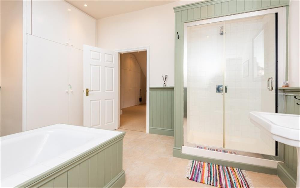 Bath and large shower in the en suite bathroom  at The Lawn House in Modbury