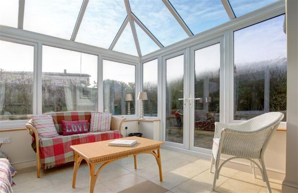 Ground floor: Conservatory with french doors to the garden at The Lifeboat House, Brancaster near Kings Lynn